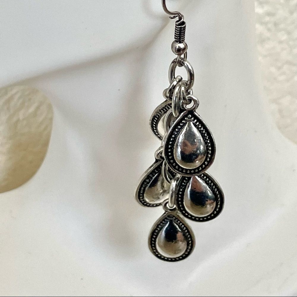 Silver tone teardrop charm earrings